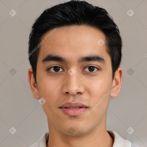 Joyful asian young-adult male with short  black hair and brown eyes