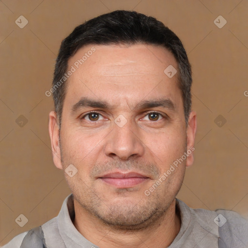 Joyful white adult male with short  brown hair and brown eyes