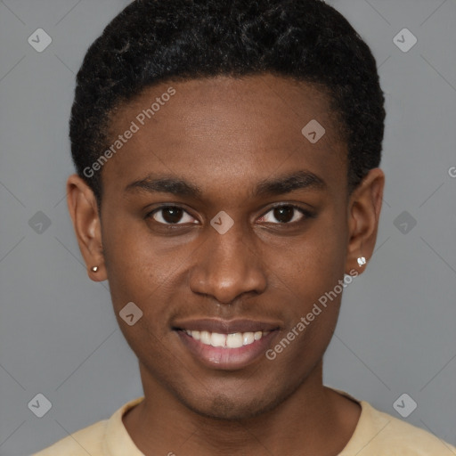 Joyful black young-adult male with short  brown hair and brown eyes