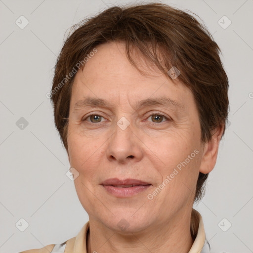 Joyful white adult female with short  brown hair and grey eyes