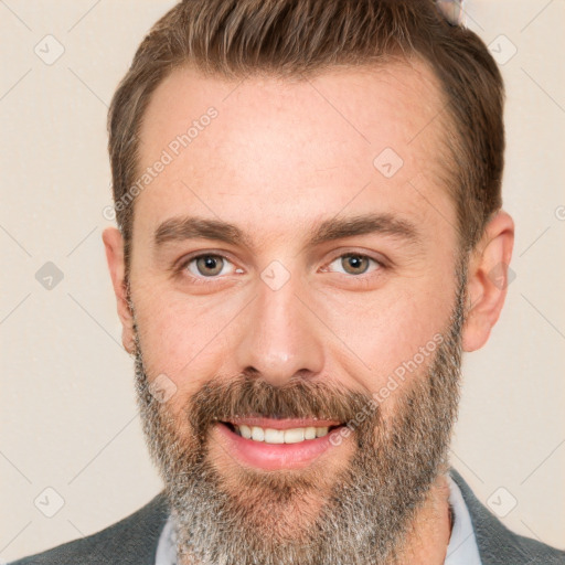 Joyful white adult male with short  brown hair and brown eyes