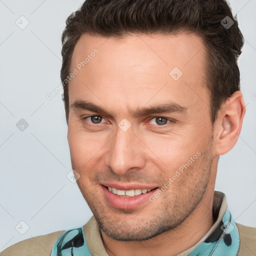 Joyful white young-adult male with short  brown hair and brown eyes