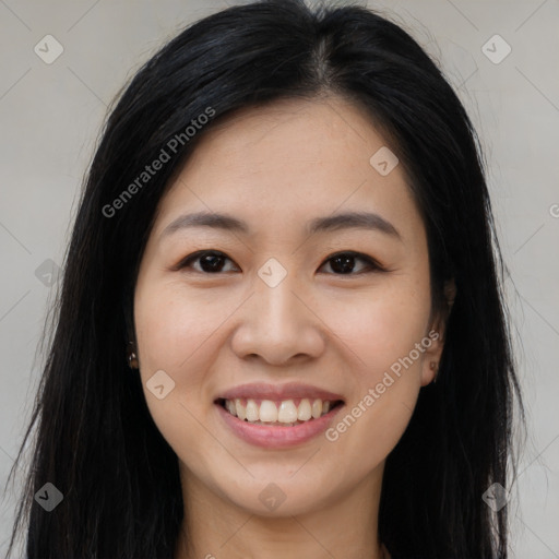 Joyful asian young-adult female with long  brown hair and brown eyes