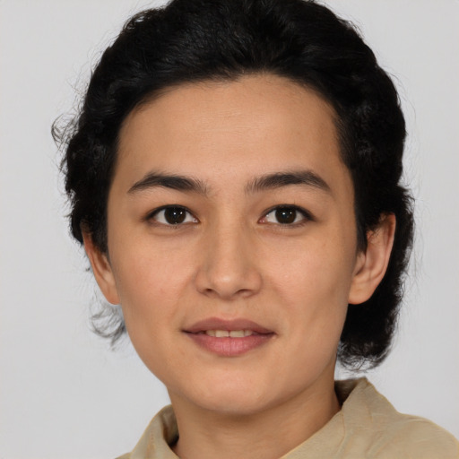 Joyful latino young-adult female with medium  black hair and brown eyes