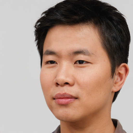 Neutral asian young-adult male with short  black hair and brown eyes