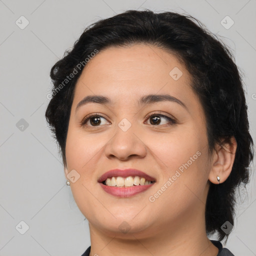 Joyful latino young-adult female with medium  black hair and brown eyes