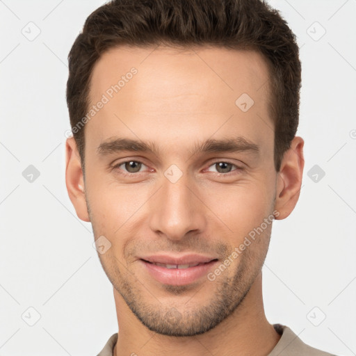 Joyful white young-adult male with short  brown hair and brown eyes