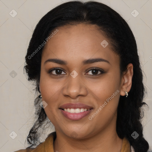 Joyful black young-adult female with long  black hair and brown eyes