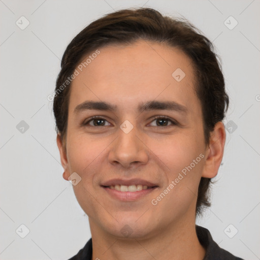 Joyful white young-adult male with short  brown hair and brown eyes