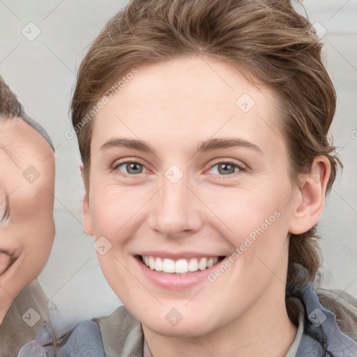 Joyful white young-adult female with medium  brown hair and blue eyes