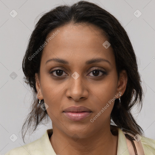 Joyful black young-adult female with medium  brown hair and brown eyes