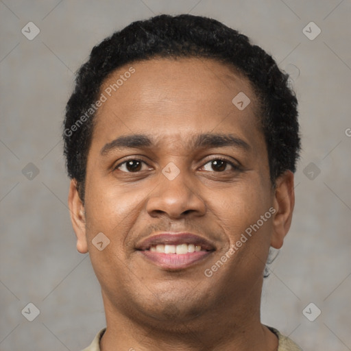 Joyful latino young-adult male with short  brown hair and brown eyes