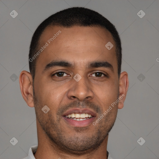 Joyful latino young-adult male with short  brown hair and brown eyes