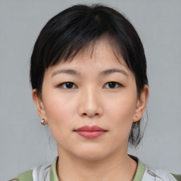 Neutral asian young-adult female with medium  brown hair and brown eyes