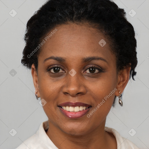 Joyful black young-adult female with short  brown hair and brown eyes