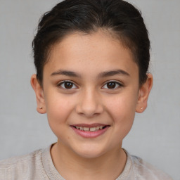 Joyful white child female with short  brown hair and brown eyes