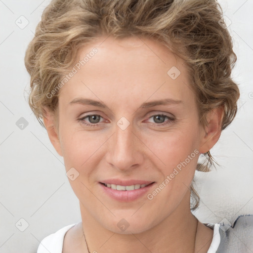 Joyful white young-adult female with short  brown hair and blue eyes