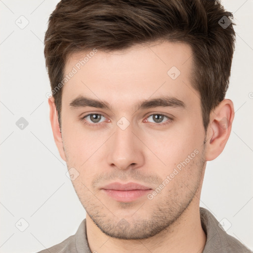 Neutral white young-adult male with short  brown hair and brown eyes