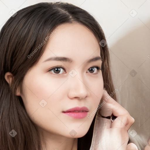 Neutral white young-adult female with long  brown hair and brown eyes