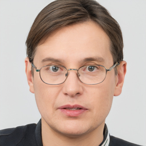 Joyful white adult male with short  brown hair and grey eyes