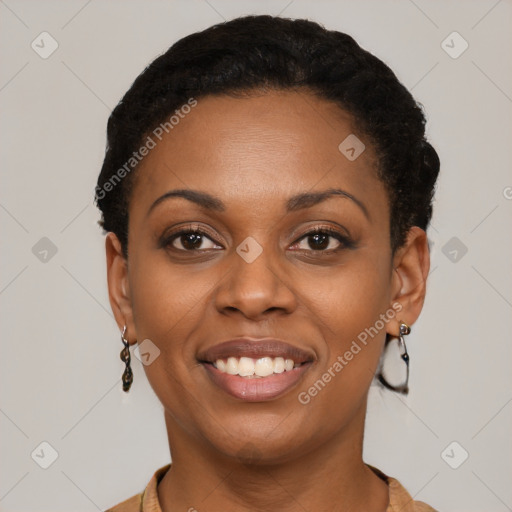 Joyful black young-adult female with short  black hair and brown eyes