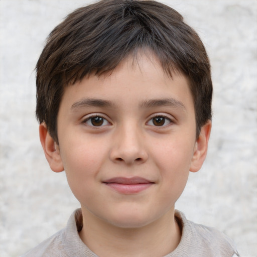 Joyful white child male with short  brown hair and brown eyes