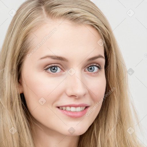 Joyful white young-adult female with long  brown hair and blue eyes