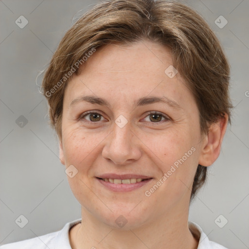 Joyful white adult female with short  brown hair and brown eyes