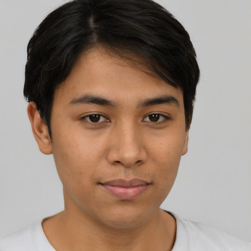 Joyful asian young-adult male with short  brown hair and brown eyes