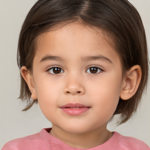 Joyful white child female with medium  brown hair and brown eyes