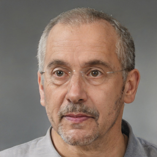 Neutral white middle-aged male with short  gray hair and brown eyes