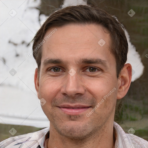 Joyful white adult male with short  brown hair and brown eyes