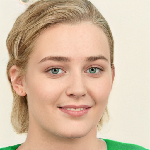 Joyful white young-adult female with medium  brown hair and green eyes