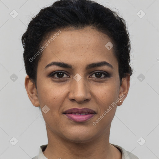 Joyful latino young-adult female with short  brown hair and brown eyes