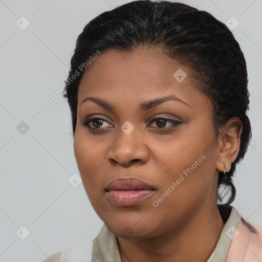 Joyful black young-adult female with medium  black hair and brown eyes