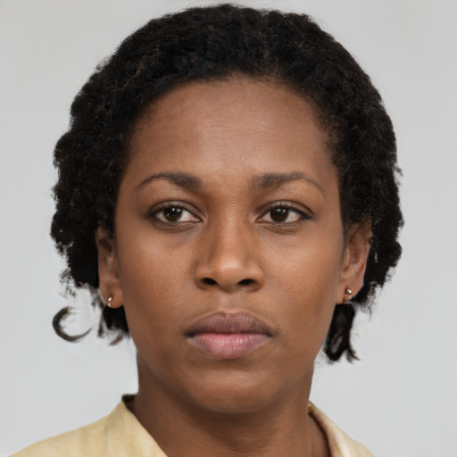Neutral black young-adult female with short  brown hair and brown eyes