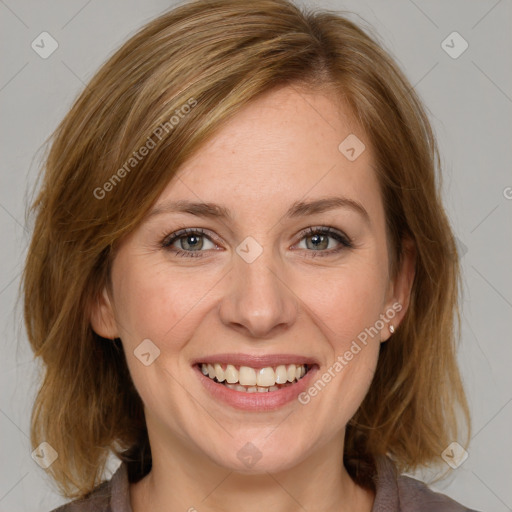 Joyful white young-adult female with medium  brown hair and blue eyes