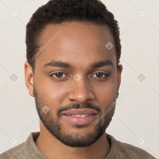 Joyful black young-adult male with short  brown hair and brown eyes