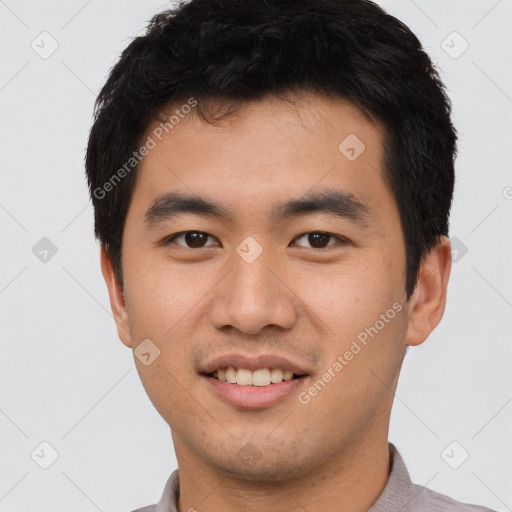 Joyful white young-adult male with short  black hair and brown eyes