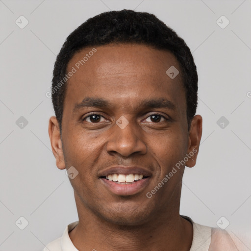 Joyful black young-adult male with short  black hair and brown eyes