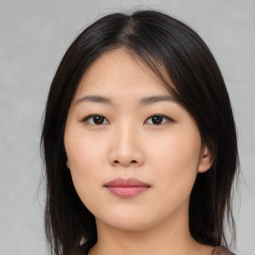 Neutral asian young-adult female with medium  brown hair and brown eyes