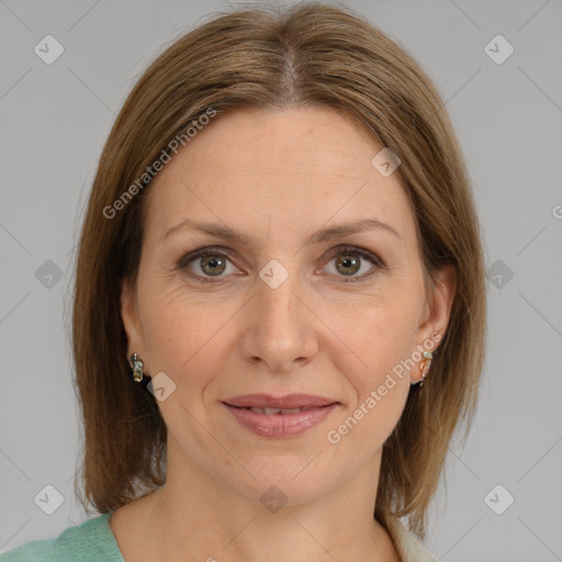 Joyful white adult female with medium  brown hair and grey eyes