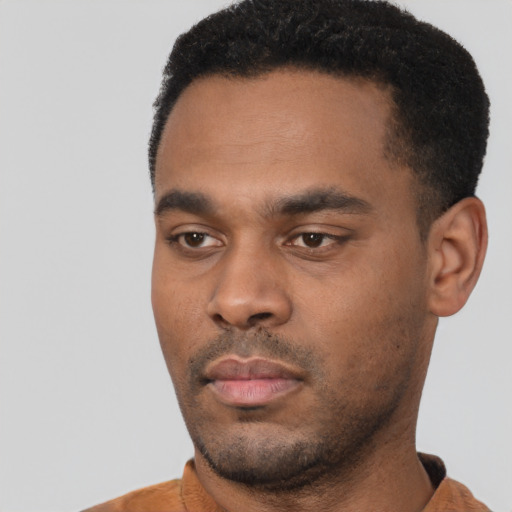 Neutral black young-adult male with short  black hair and brown eyes