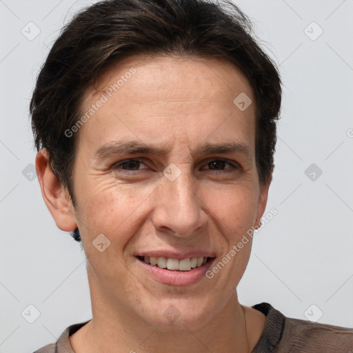 Joyful white adult female with short  brown hair and grey eyes