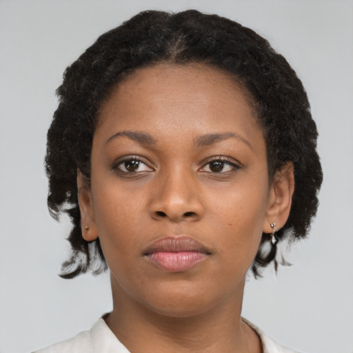 Neutral black young-adult female with short  brown hair and brown eyes