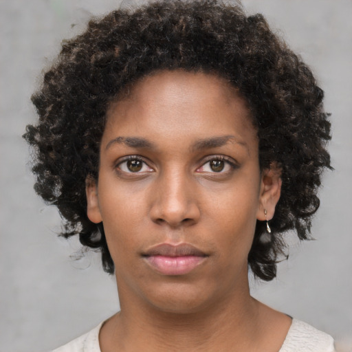 Neutral black young-adult female with short  brown hair and brown eyes