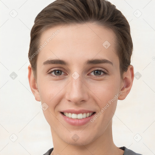 Joyful white young-adult female with short  brown hair and grey eyes