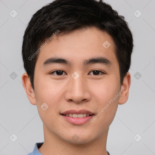 Joyful asian young-adult male with short  brown hair and brown eyes