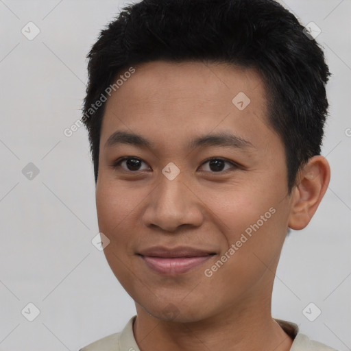 Joyful asian young-adult male with short  black hair and brown eyes