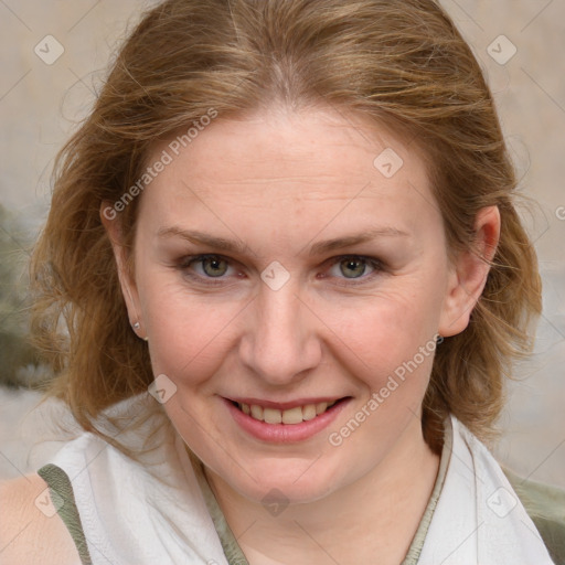 Joyful white young-adult female with medium  brown hair and blue eyes